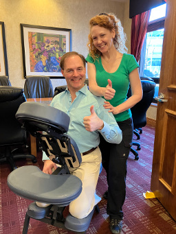Huge thumbs up from a happy chair massage client after a stress busting corporate chair massage in downtown Minneapolis!